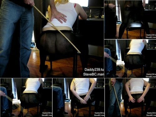 SlaveBC 55pantyhose wearing slave gets caned while typing out her chore list 1080p image