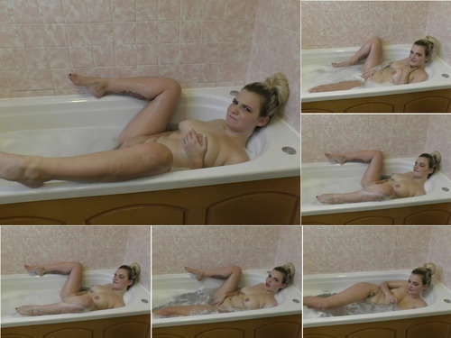 Bad Dolly Masturbating In The Bath Tub image
