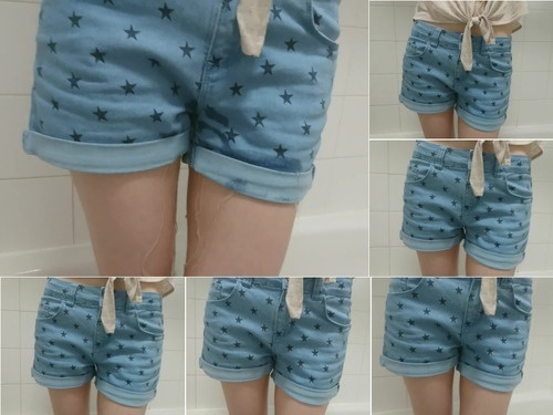 Spanked girl wets her denim shorts image