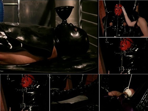 Boot Worship Trapped In Latex 2 – Jacqueline Du Monde  Anna Valentina and rubber slave image