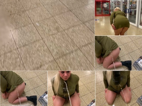 Human Toilet Devil Sophie Pissed in the middle of the exit of the shopping center image