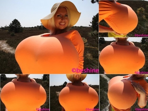 Scenes Beshine 2013-06-22 – Tight orange top and extreme augmented breasts 1080p Full HD image