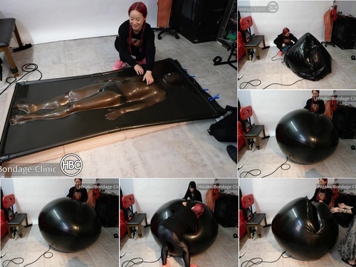Gagged Two Japanese Mistresses Put Sub Inside Big Rubber Ball and Vacuum Bed image