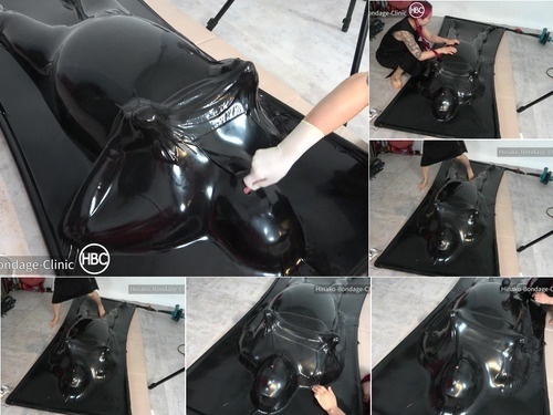 Taped Nipple Play in the Latex Vacuum Bed image