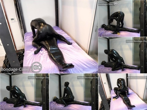 Taped Latex Sub Gets Mummified and has Dick Toyed With image