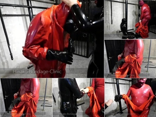 Caged Big Latex Man Struggles to Put on MD Latex Suit image