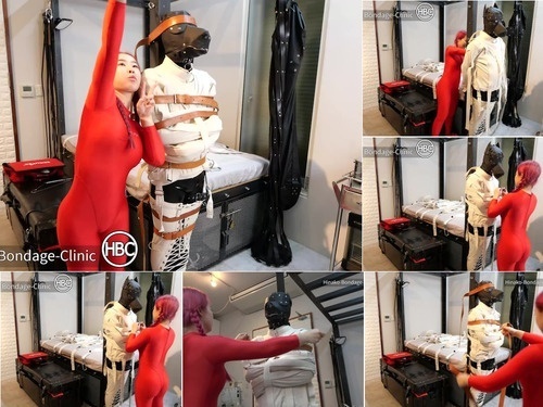 spandex Rubber Doggy Sub Gets Tied in Canvas Straitjacket in Upright Position image