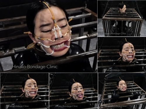 Caged Stupid Fucking Latex Bitch Gets Locked in a Cage andFace Stretched Out image