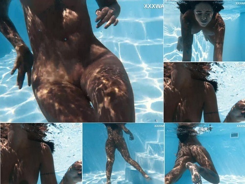 Underwater Venezuelan juicy teen showing big tits underwater image